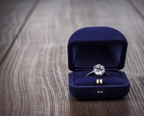 ring in the box on wooden table