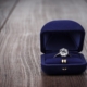 ring in the box on wooden table